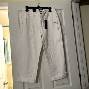 White jeans with Silver stitching on hips.